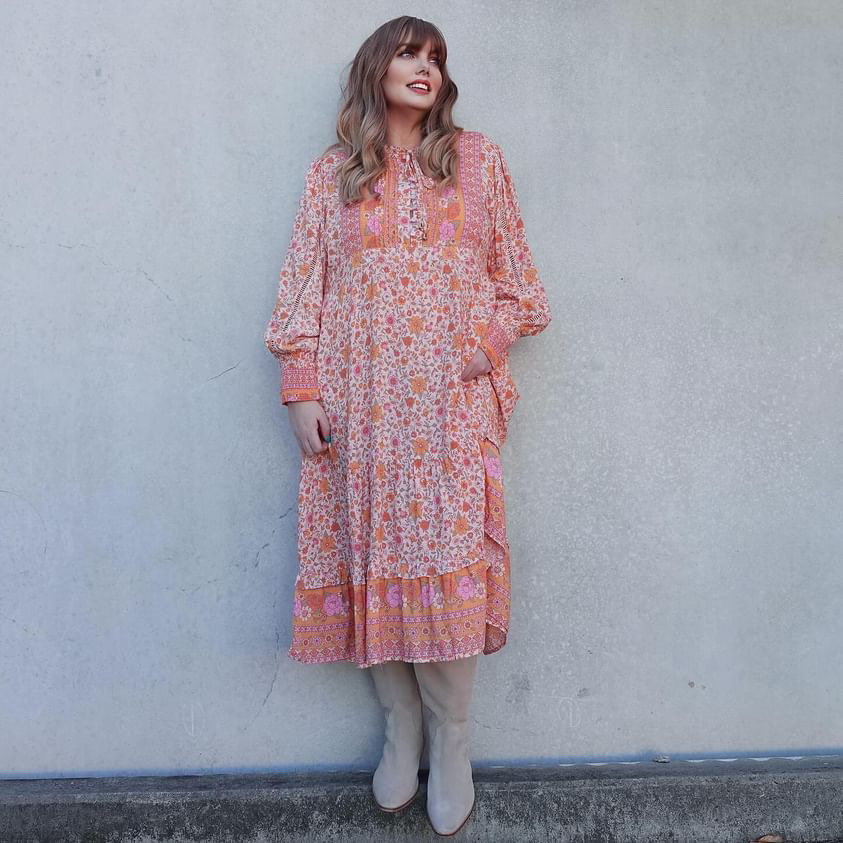 Suede boots like Camberley or Kruft go well with feminine, flowy dresses. Melinda Woods is wearing the Camberley boots on this picture.