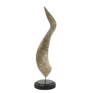 Horn on wooden pedestal