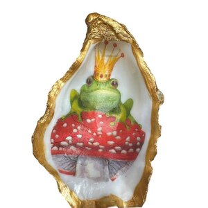 Hand-decorated golden oyster with frog