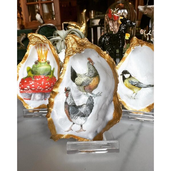 Hand-decorated golden oyster with frog