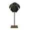 Horseshoe crab on golden pedestal