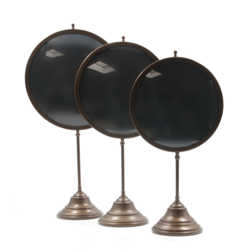 Round bronze frame on foot