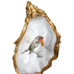 Hand-decorated golden oyster with robin