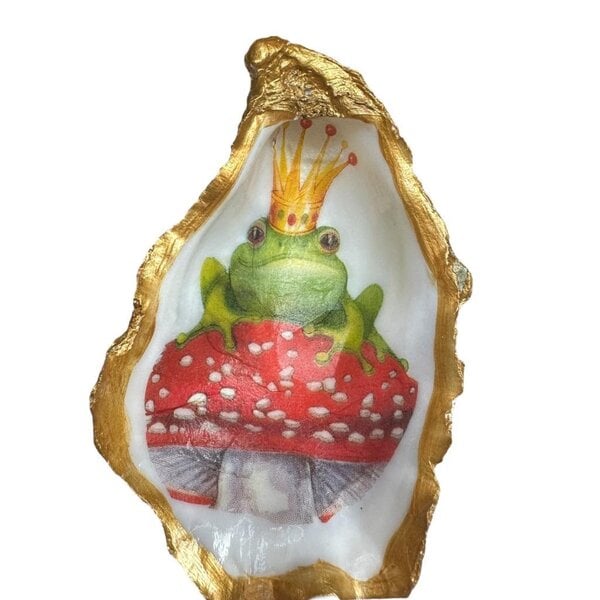 Hand-decorated golden oyster with frog