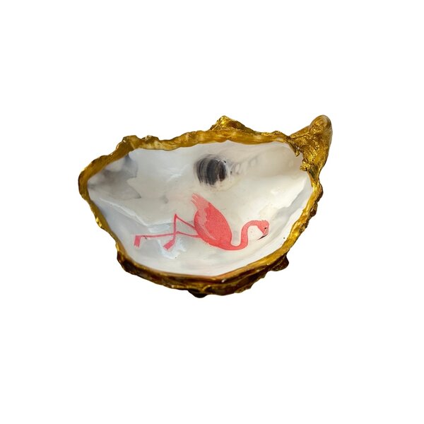 Hand-decorated golden oyster with flamingo