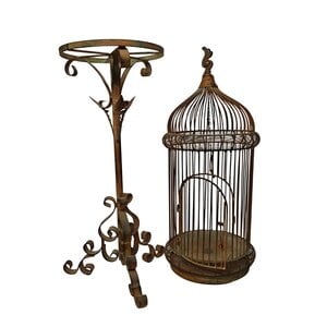Antique bird cage on stand