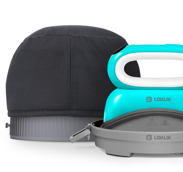 LOKLiK Impress™ Hat in its safety base in front of the hat pressing lid and ironing mat.