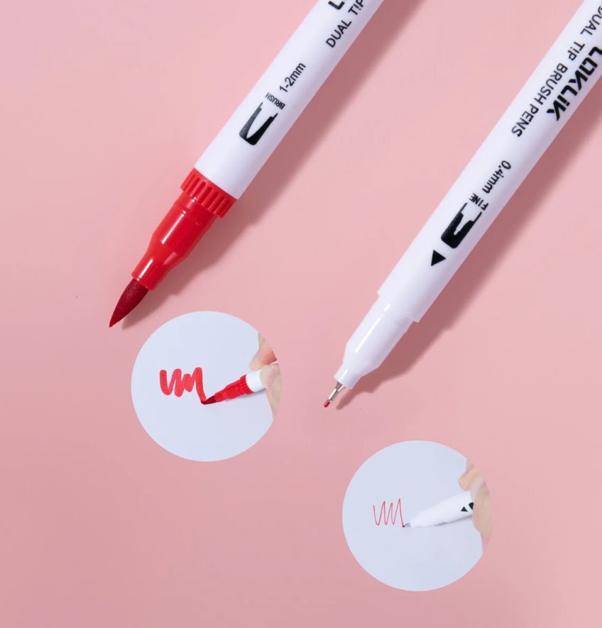 Two red LOKLiK dual tip brush pens with the cap off showing the different size of the nibs: wide and thin.