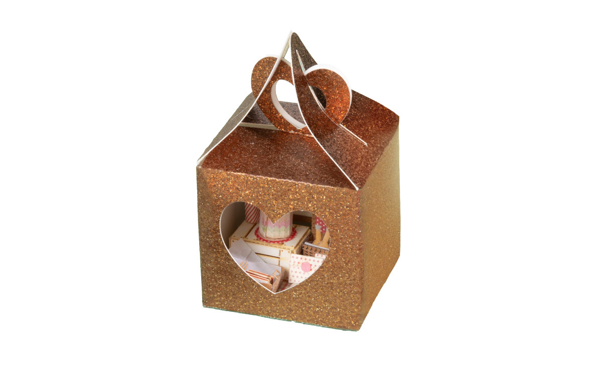 Box made of glitter cardstock with a heart cut out on one side. The folds were scored with the iCraft™ scoring stylus.