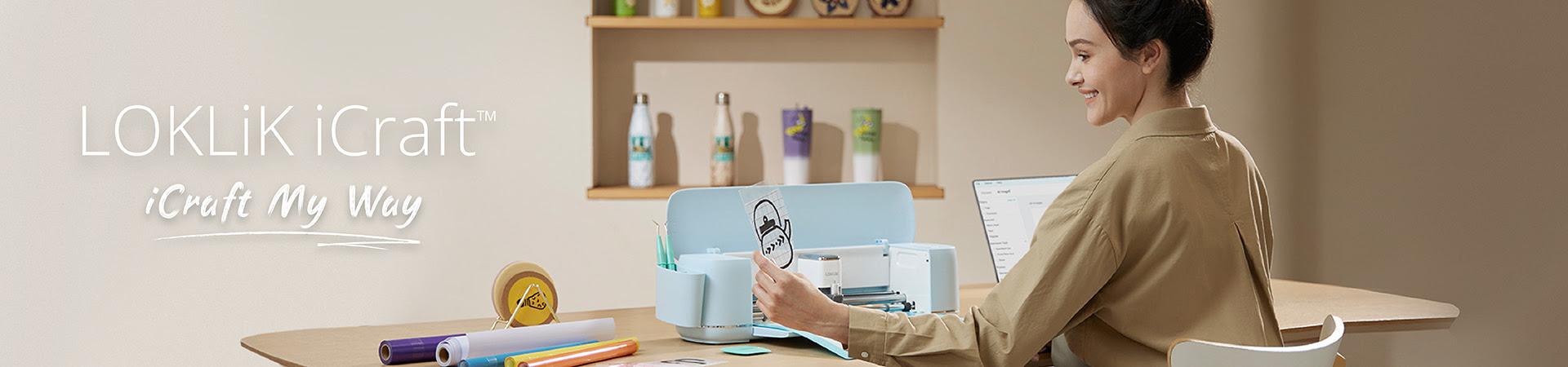 Discover our new LOKLiK iCraft cutting machine. The image shows a woman using the LOKLiK iCraft at her desk