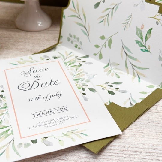 Wedding invitation with gold foil details.