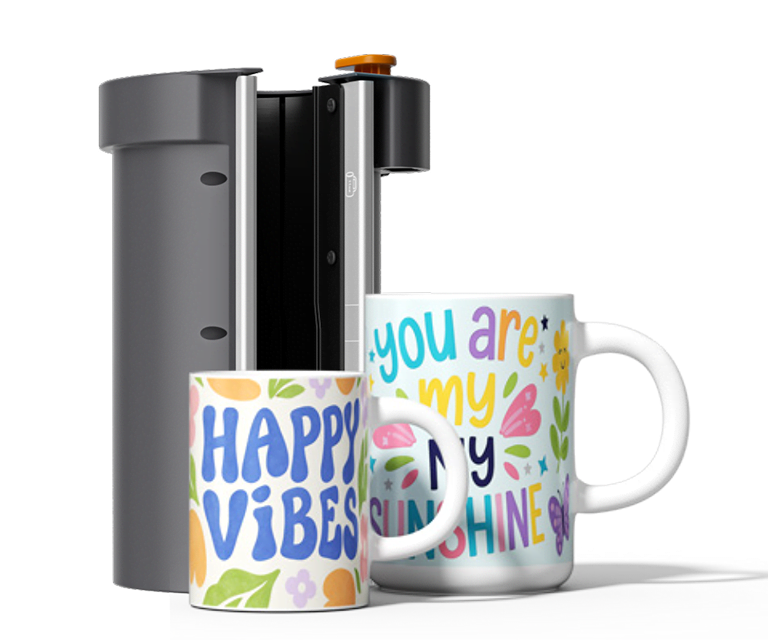 Two different sized mugs in front of the heat plate designed for mugs.