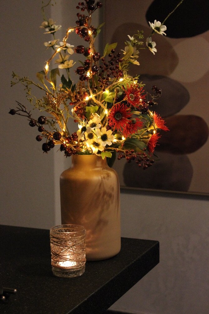 Kerstboeket, vaas, lichtje