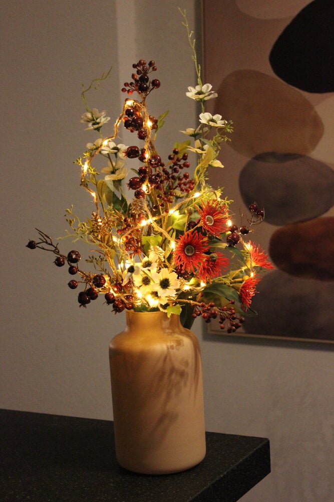 Kerstboeket, vaas, lichtje