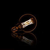 Lichtbron LED filament bol Ø9 5 - E27 6W dimbaar / Amberkleurig glas
