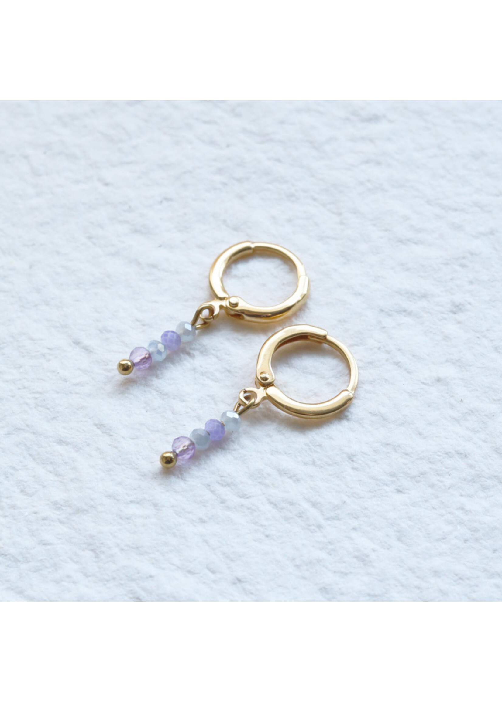 Earrings with charm and beads