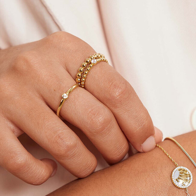Goudvergulde sterrenarmband met parelmoer en zirkonia
