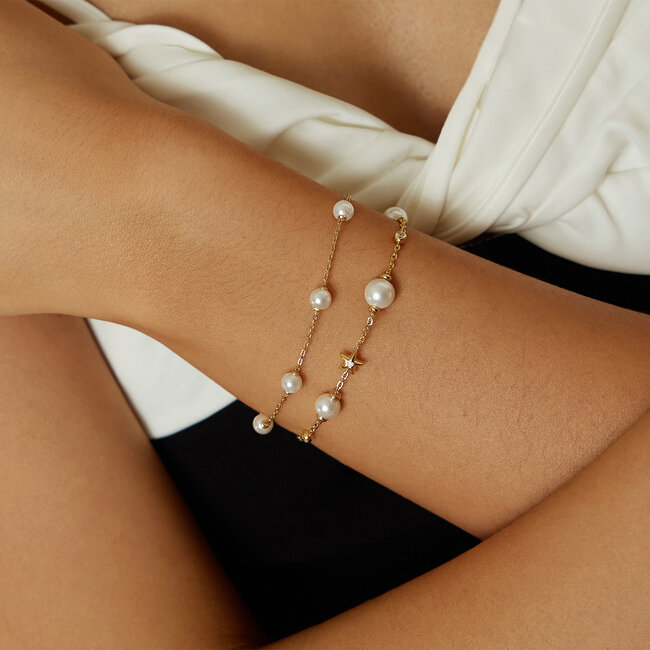 Goudvergulde twist schakelarmband met een zoetwaterparel 18,5 cm
