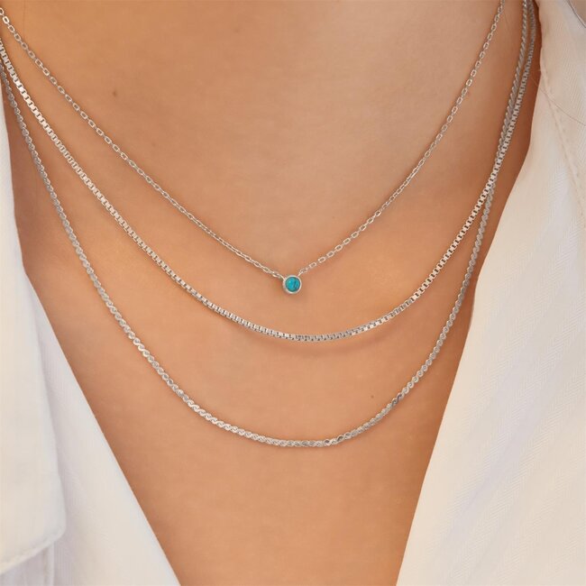 Zilveren anker schakelketting met een turkoois steentje 45 cm