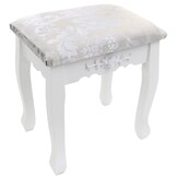 Een cosmetische kaptafel met een spiegel en een krukje