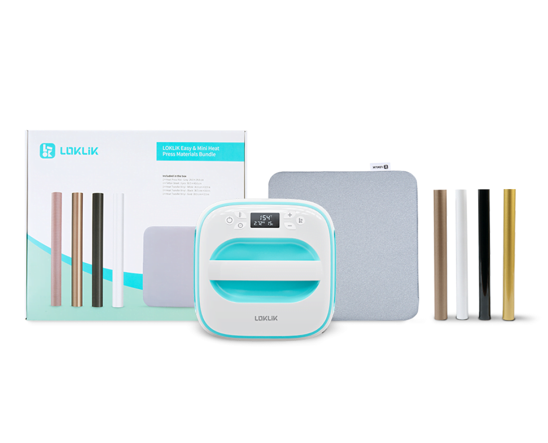 View of a LOKLiK Easy Heat Press in LOKLiK Blue in front of an Easy Heat Press Starter Pack and its contents: a heat press mat, a roll of teflon sheets and heat transfer vinyl in white, black and gold.