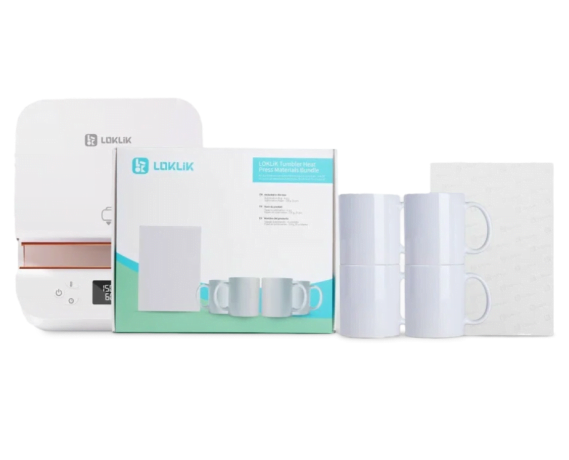 View of a LOKLiK Auto Tumbler Heat Press behind an Auto Tumbler Heat Press Starter Pack and its conents: 4 blank sublimation mugs and sublimation paper. 