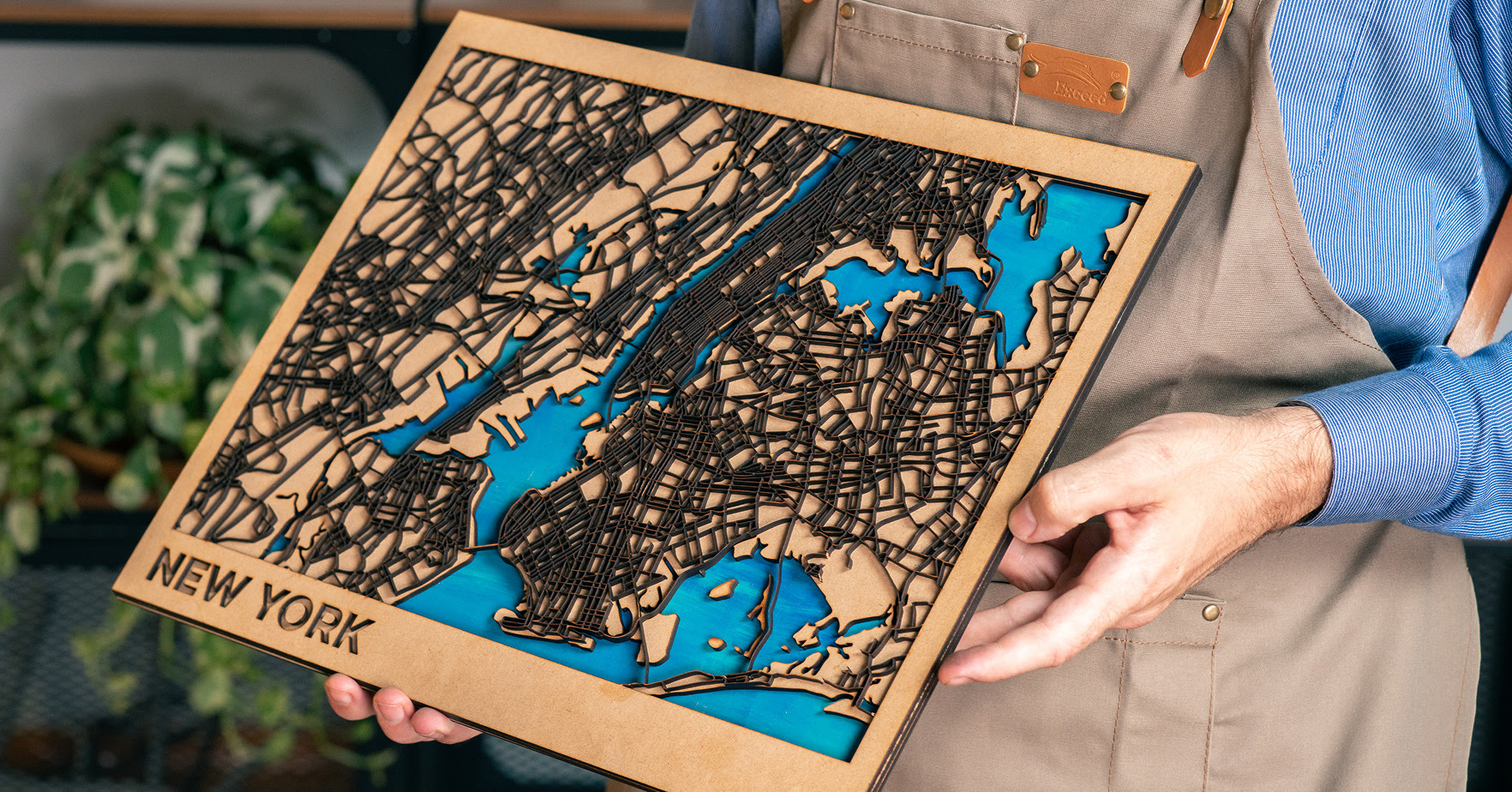 Person holding a lasercut map of New York