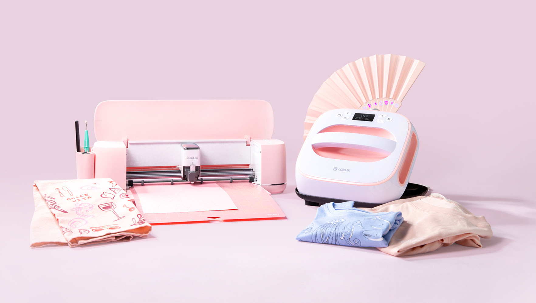 Display of a pink LOKLiK iCraft and LOKLiK Easy Heat Press against a pink background.