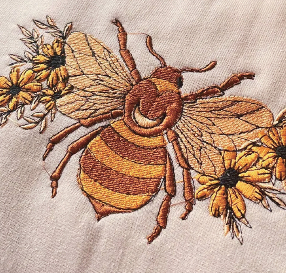 Embroidered design of a honey bee with flowers