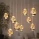 Highlight Hängelampe Egg oval 12-flammig L 140 cm Champagner