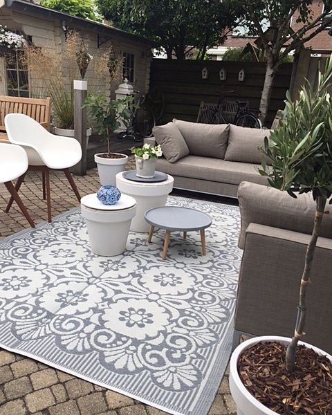 Grauer-weißer Outdoor-Teppich