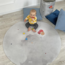 Tapis de jeu rond avec motif montgolfière en tons doux, durable et confortable