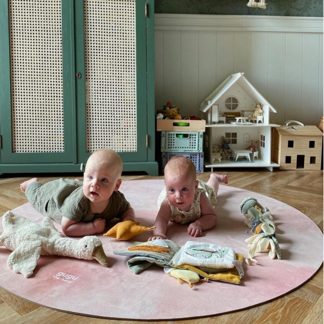 Round play mat in soft pastel shades with cloud design, durable and comfortable