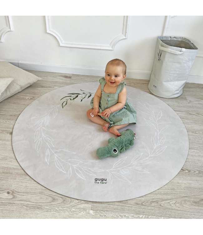 Rond speelkleed in beige met subtiele olijftakjes, duurzaam en comfortabel