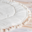 Tapis de jeu style bohème avec pompons en écru – doux, élégant et parfait pour la chambre de bébé