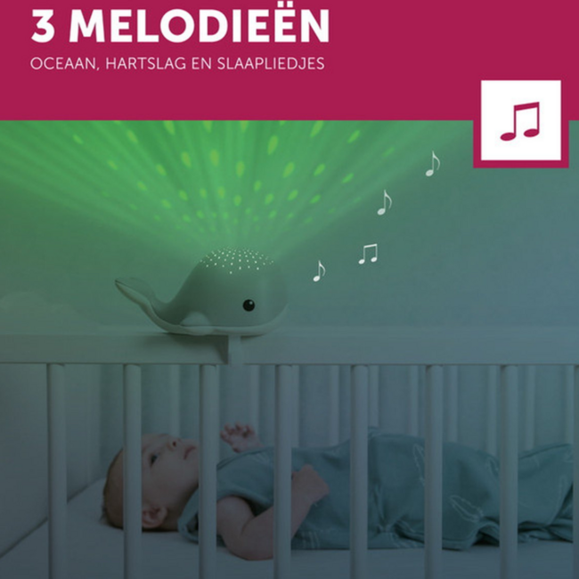 Soothing whale-shaped projector for children in calming blue