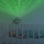 Soothing whale-shaped projector for children in calming blue