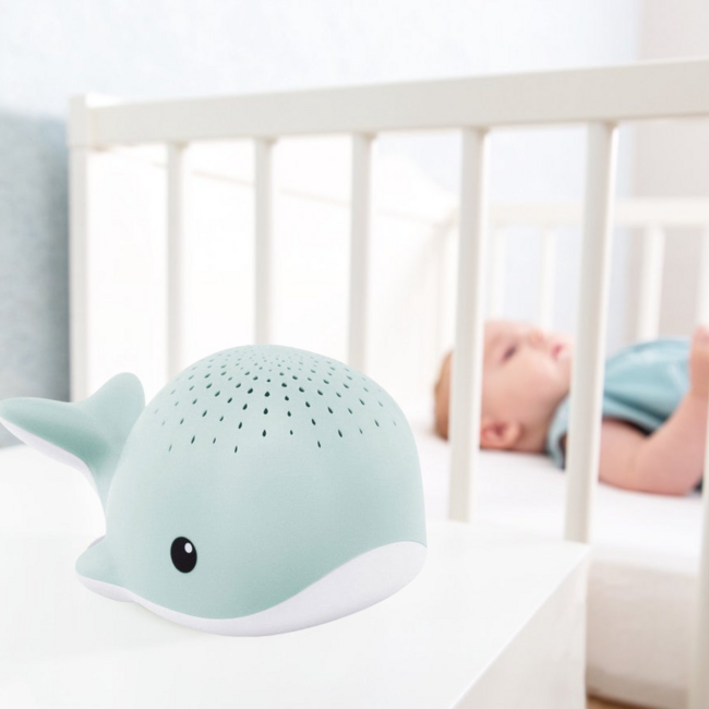 Soothing whale-shaped projector for children in calming blue