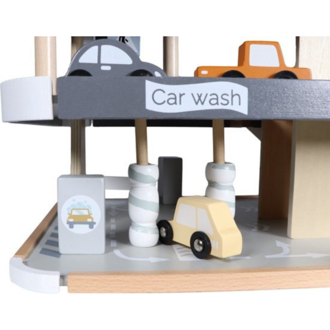 Wooden parking garage with multiple levels and play features