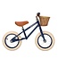 Blauwe 12 inch loopfiets met verstelbaar stuur en rieten mand
