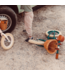 Groene 12 inch loopfiets met verstelbaar zadel en rieten mand