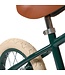 Groene 12 inch loopfiets met verstelbaar zadel en rieten mand