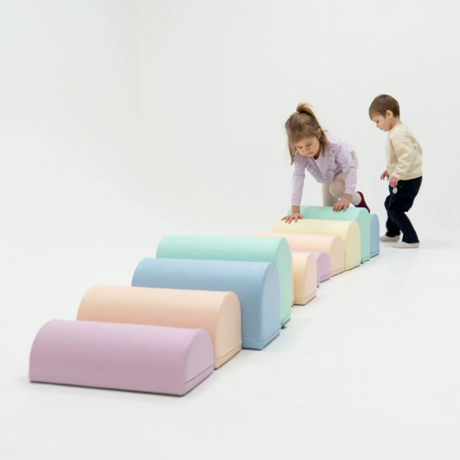 Foam blocks obstacle course in soft pastel colors – safe and motor skills boosting