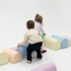 Foam blocks obstacle course in soft pastel colors – safe and motor skills boosting