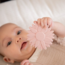 Sunflower-shaped teething toy in pink – soft silicone relief toy for babies