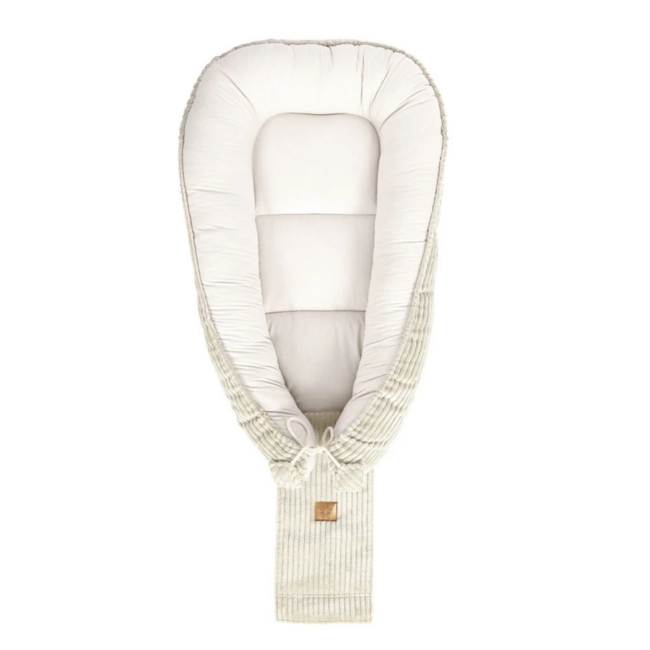 Baby nest made of corduroy fabric in ecru – soft and cozy for your little one