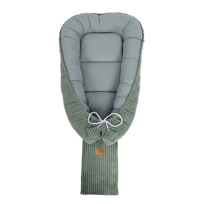 Baby nest made of corduroy fabric in green – soft and cozy for your little one
