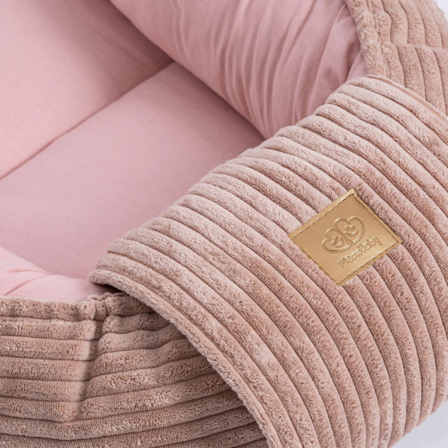 Baby nest made of corduroy fabric in pink – soft and cozy for your little one