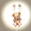 Wall lamp – cute bear on a swing for a dreamy kids’ room