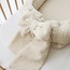 Babynest mit Schleife aus cremefarbenem Teddystoff – weich, sicher und kuschelig